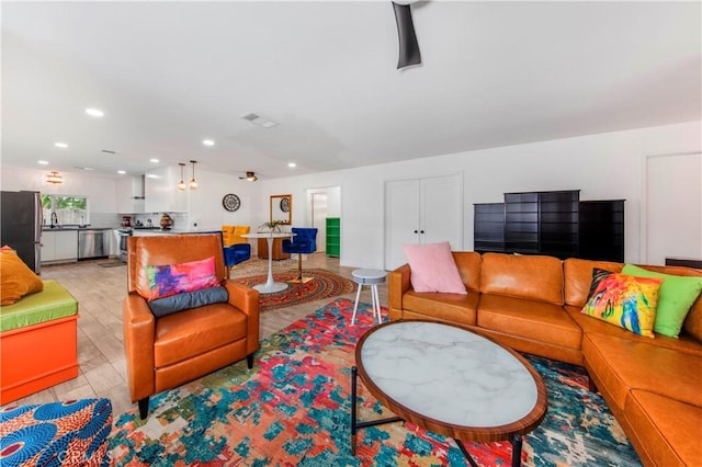 living room with recessed lighting and visible vents