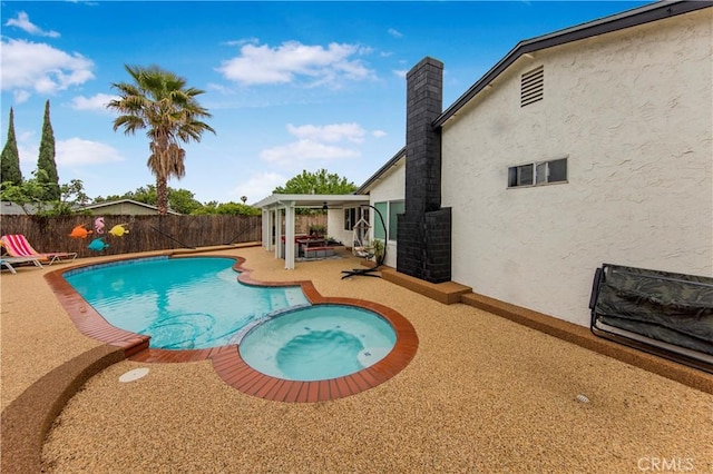 view of pool with a patio, a fenced backyard, and a pool with connected hot tub