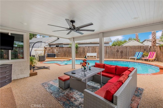 view of pool featuring outdoor lounge area, a fenced in pool, a fenced backyard, and a patio area