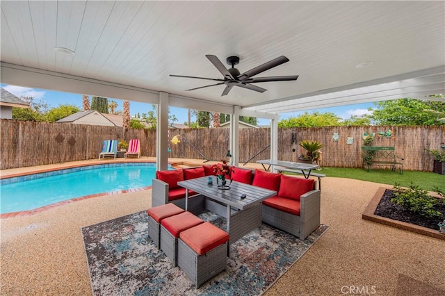 view of pool featuring a fenced backyard, a patio, an outdoor hangout area, and ceiling fan