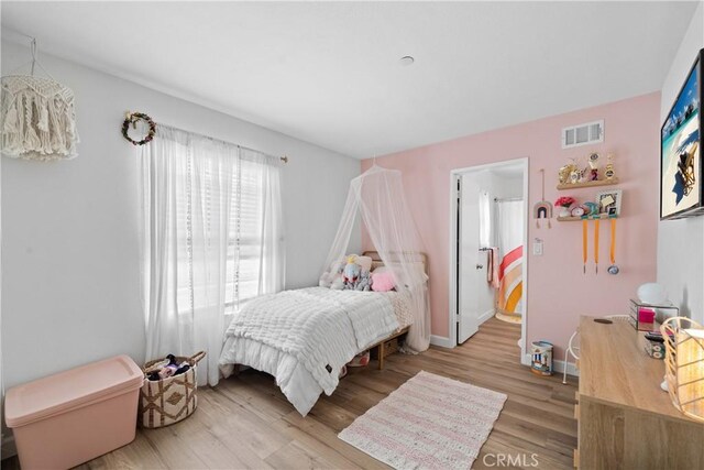 1040 Calle Del Cerro Unit 101, San Clemente, CA 92672 - bedroom with light wood finished floors and baseboards