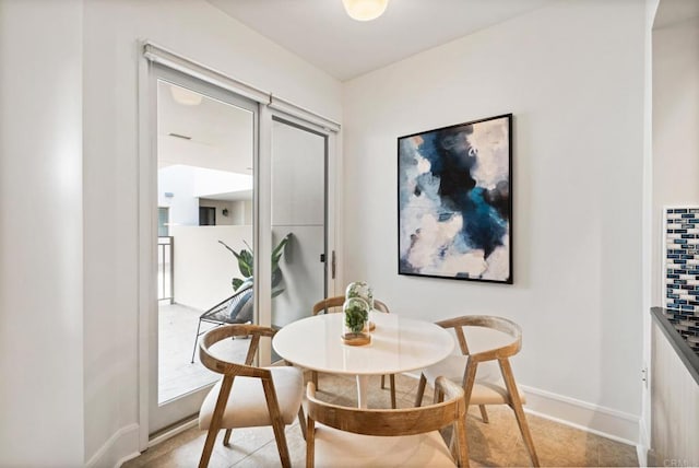 dining room featuring baseboards