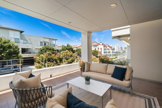 view of patio featuring an outdoor hangout area and a balcony