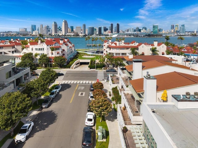bird's eye view featuring a view of city and a water view