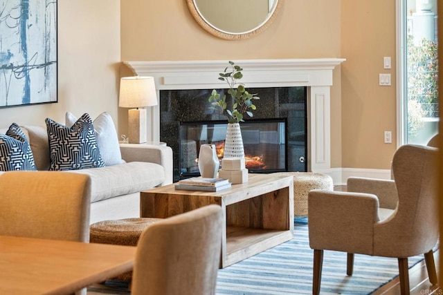 sitting room featuring a high end fireplace