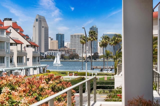 balcony featuring a view of city and a water view