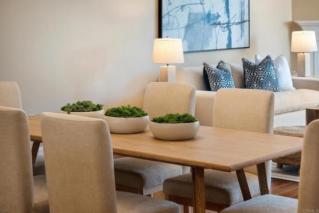 dining area with wood finished floors