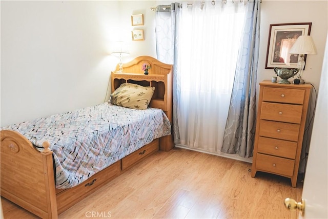 bedroom with wood finished floors