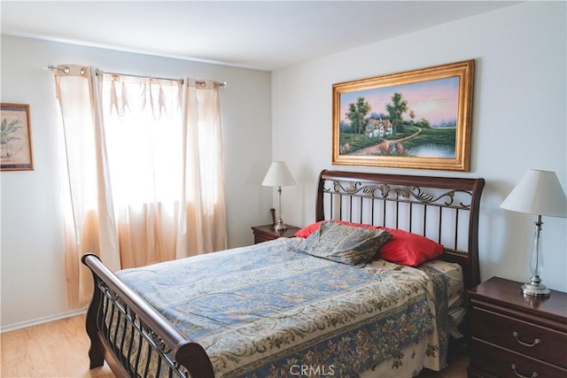 bedroom featuring wood finished floors