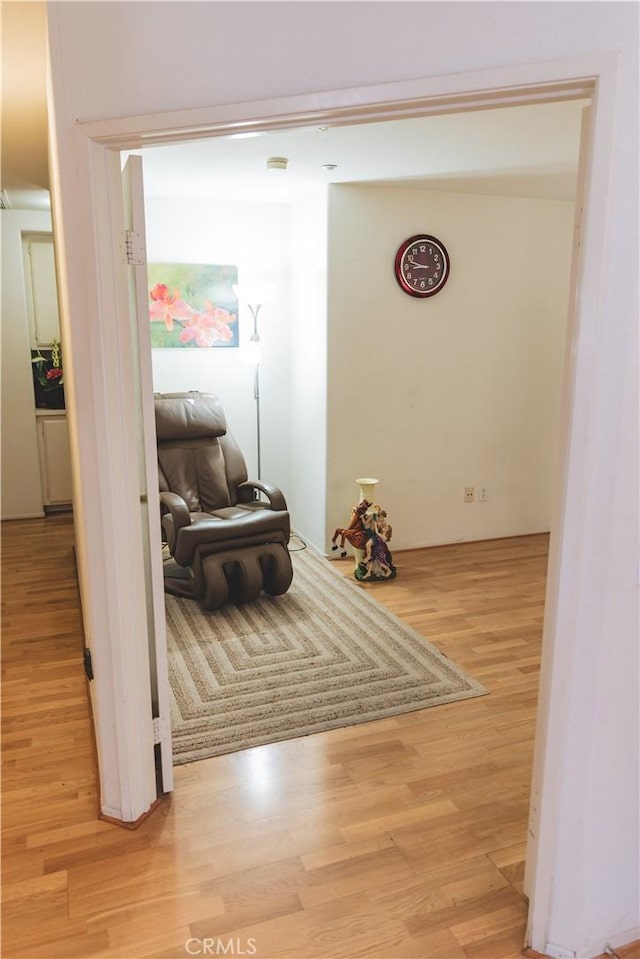 hall with wood finished floors