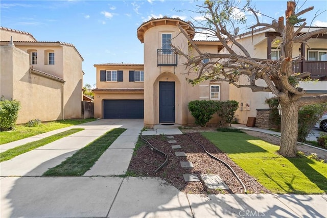 view of front of property featuring a garage, stucco siding, concrete driveway, and a tile roof