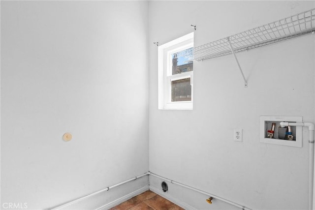 washroom with laundry area, baseboards, and washer hookup