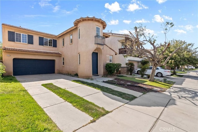 mediterranean / spanish house featuring a garage, driveway, stucco siding, and a tiled roof