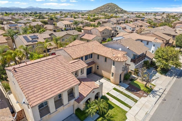 drone / aerial view with a residential view and a mountain view