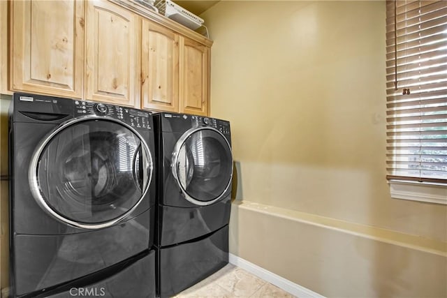 26371 Spyglass Dr, Lake Arrowhead, CA 92352 - clothes washing area featuring separate washer and dryer, baseboards, and cabinet space