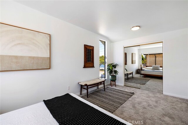 5263 E Paoli Way, Long Beach, CA 90803 - bedroom with a closet, baseboards, vaulted ceiling, and carpet floors