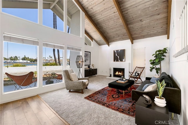 5263 E Paoli Way, Long Beach, CA 90803 - living area with high vaulted ceiling, wood ceiling, wood finished floors, a brick fireplace, and beam ceiling