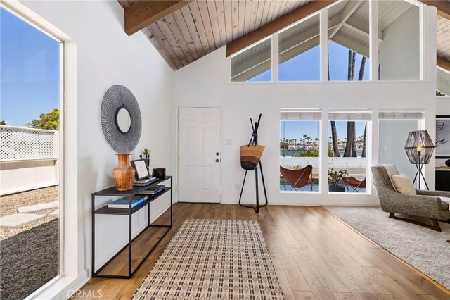 5263 E Paoli Way, Long Beach, CA 90803 - foyer entrance featuring beam ceiling, high vaulted ceiling, wooden ceiling, and wood finished floors
