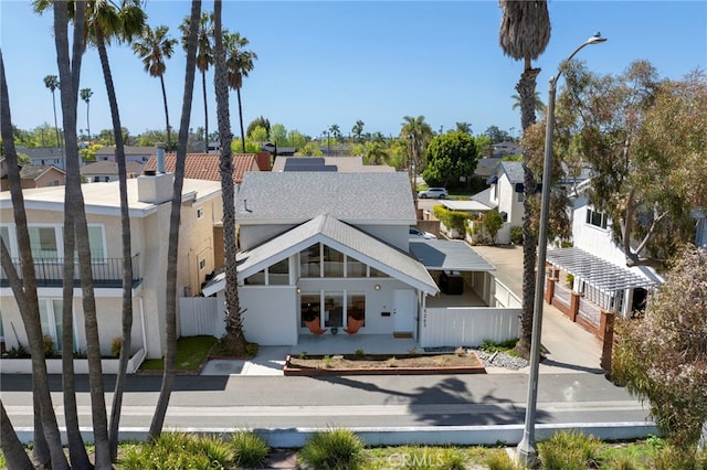 5263 E Paoli Way, Long Beach, CA 90803 - exterior space with a chimney, stucco siding, a residential view, and a fenced front yard