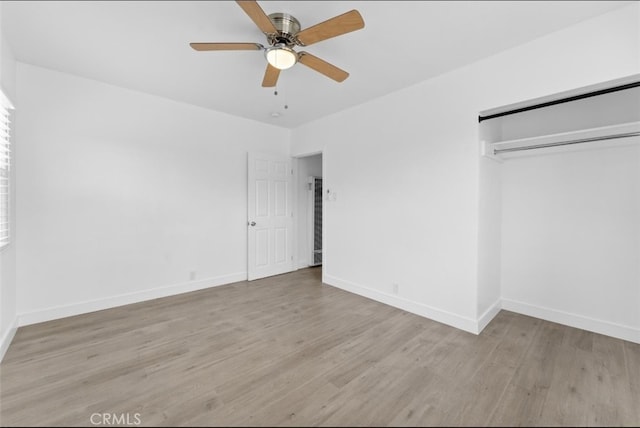 840 W 115th St, Los Angeles, CA 90044 - unfurnished bedroom featuring wood finished floors, baseboards, a closet, and ceiling fan