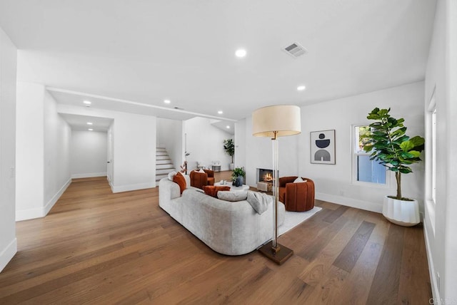 3792 Vista Pt, Bonita, CA 91902 - living area featuring stairway, a glass covered fireplace, baseboards, recessed lighting, and wood finished floors