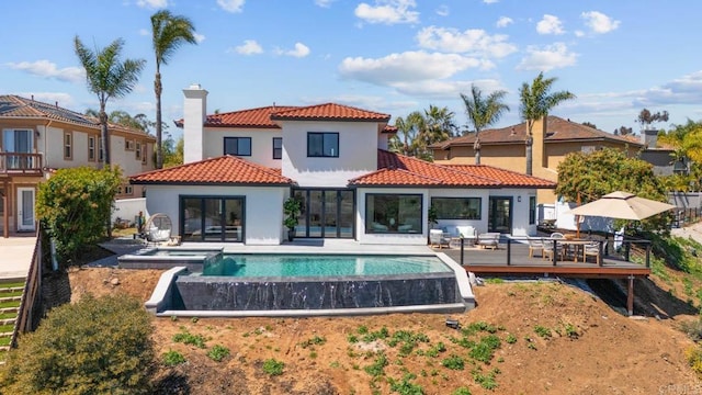 3792 Vista Pt, Bonita, CA 91902 - rear view of house featuring a tiled roof, stucco siding, a deck, a chimney, and a pool with connected hot tub