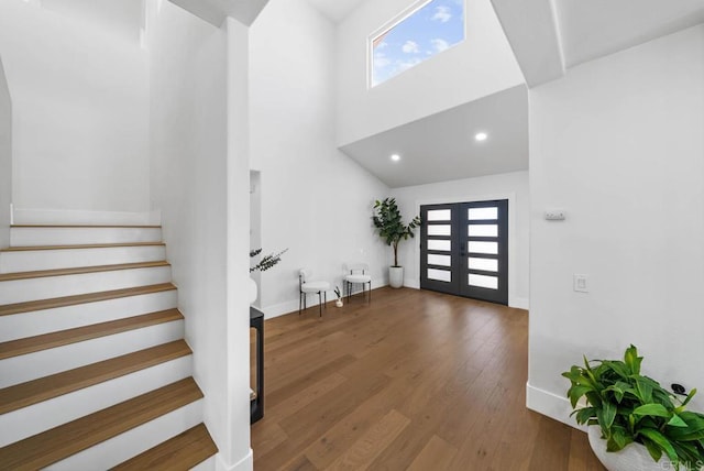 3792 Vista Pt, Bonita, CA 91902 - entryway with stairway, healthy amount of natural light, baseboards, wood finished floors, and a high ceiling