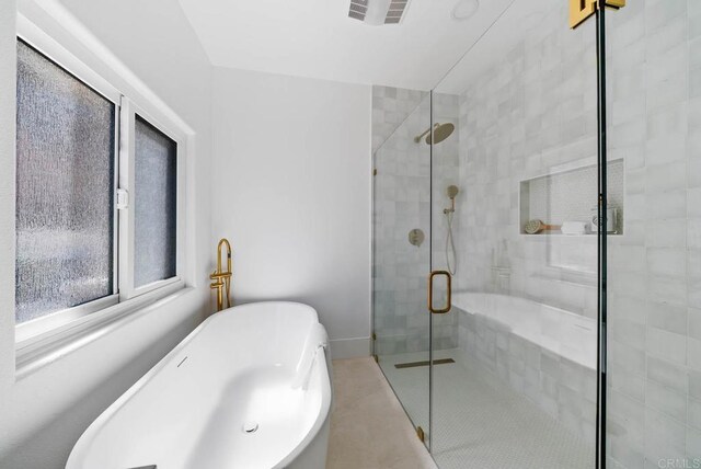 3792 Vista Pt, Bonita, CA 91902 - full bath featuring a soaking tub, a shower stall, and tile patterned floors