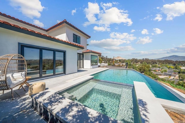3792 Vista Pt, Bonita, CA 91902 - view of swimming pool featuring a patio, a pool with connected hot tub, and a mountain view