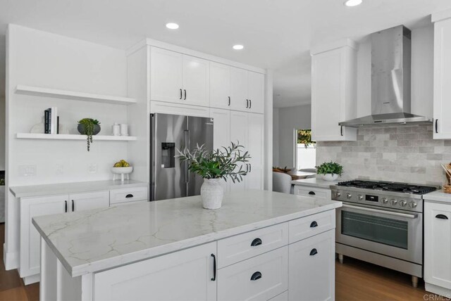 3792 Vista Pt, Bonita, CA 91902 - kitchen featuring stainless steel appliances, wall chimney range hood, tasteful backsplash, light stone countertops, and recessed lighting