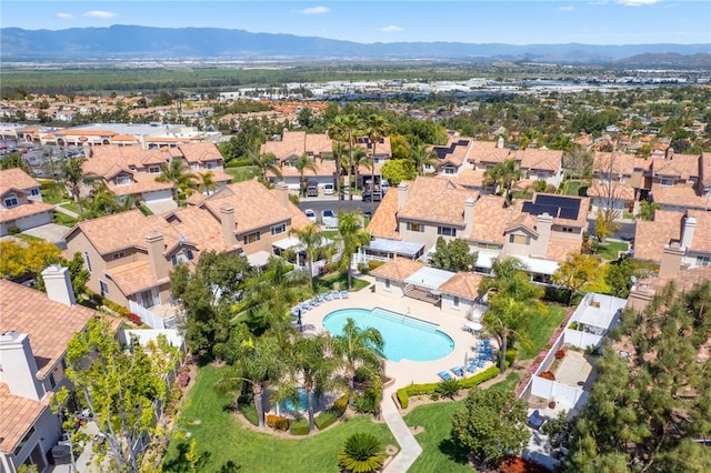 1525 Elegante Ct, Corona, CA 92882 - aerial overview of property's location featuring a pool area, mountains, and nearby suburban area