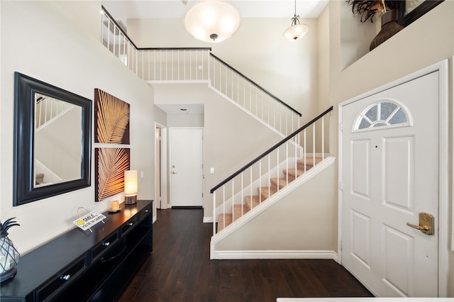 1525 Elegante Ct, Corona, CA 92882 - entryway featuring a towering ceiling, stairs, wood-type flooring, and baseboards