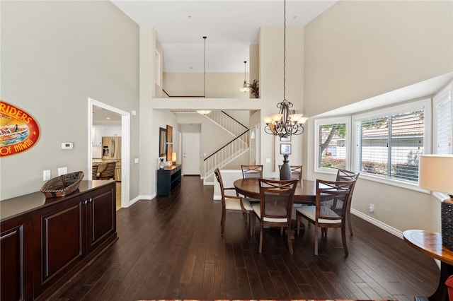 1525 Elegante Ct, Corona, CA 92882 - dining room featuring a chandelier, a towering ceiling, stairway, and dark wood-style flooring