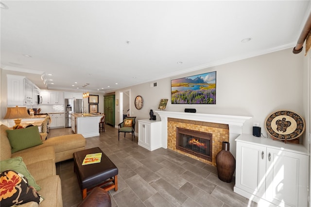 1525 Elegante Ct, Corona, CA 92882 - living room featuring recessed lighting, ornamental molding, and a glass covered fireplace
