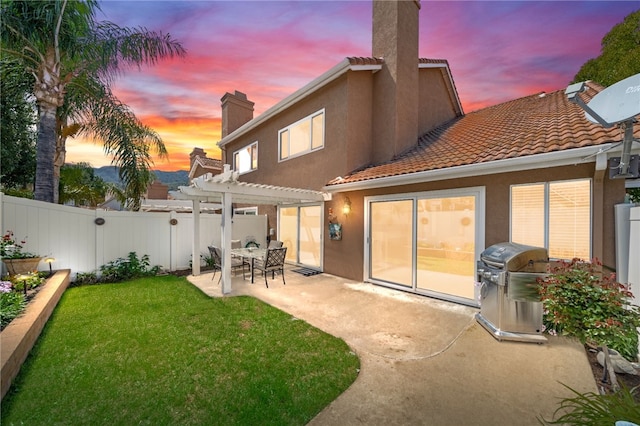 1525 Elegante Ct, Corona, CA 92882 - rear view of house featuring a pergola, a patio, stucco siding, a chimney, and a tiled roof