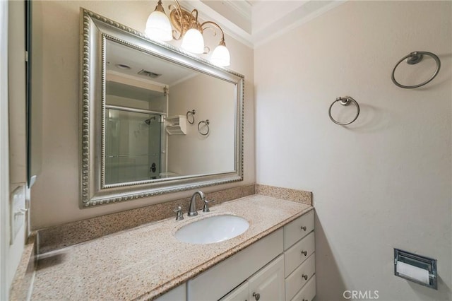 7041 Heil Ave, Huntington Beach, CA 92647 - bathroom with vanity, visible vents, crown molding, and a shower with door