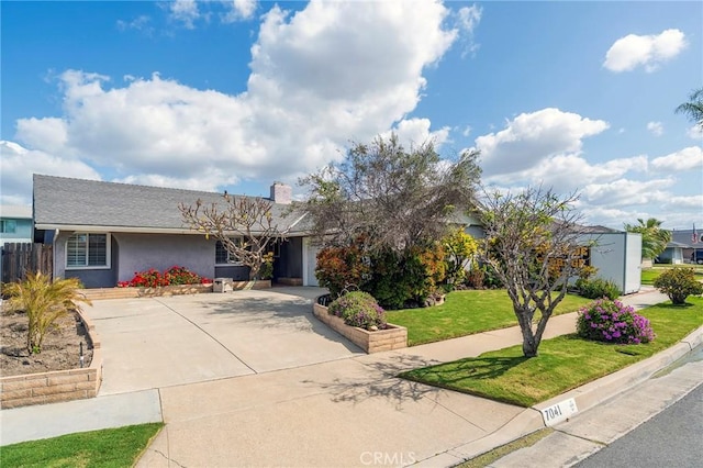 7041 Heil Ave, Huntington Beach, CA 92647 - ranch-style home with stucco siding and a front yard