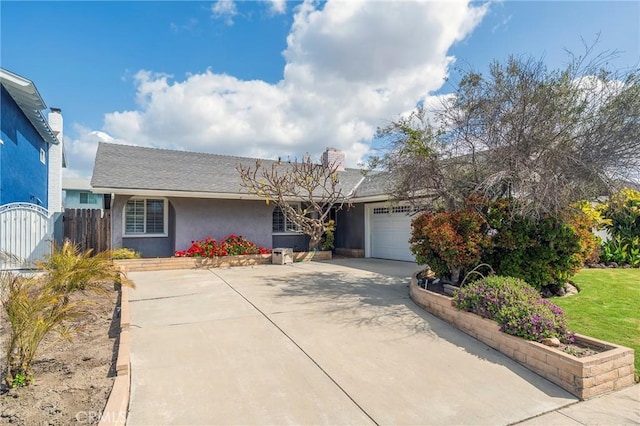 7041 Heil Ave, Huntington Beach, CA 92647 - single story home with an attached garage, concrete driveway, stucco siding, and fence