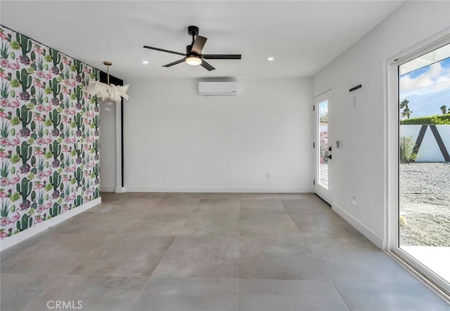 2175 N Sandra Rd, Palm Springs, CA 92262 - unfurnished living room featuring an AC wall unit, plenty of natural light, ceiling fan, baseboards, and recessed lighting