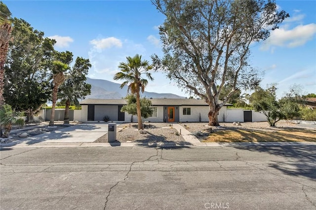 2175 N Sandra Rd, Palm Springs, CA 92262 - view of front of home with a mountain view, driveway, and stucco siding
