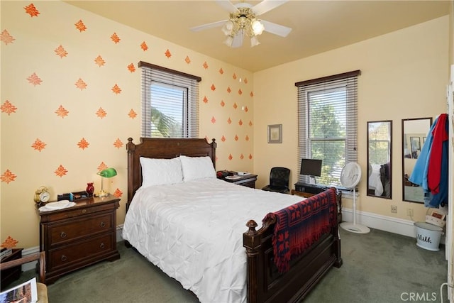 carpeted bedroom featuring wallpapered walls, baseboards, and a ceiling fan