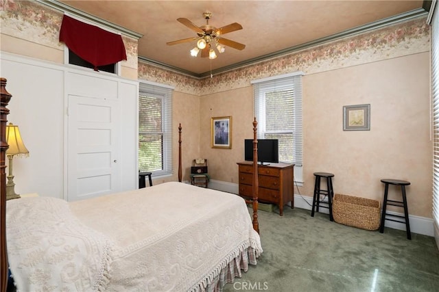 bedroom featuring baseboards, ornamental molding, and carpet floors