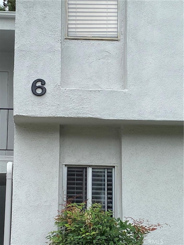 exterior details featuring stucco siding