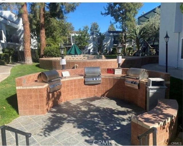 view of patio with a grill and exterior kitchen