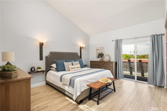 3600 E 4th St Unit 303, Long Beach, CA 90814 - bedroom featuring access to exterior, vaulted ceiling, light wood-type flooring, and baseboards