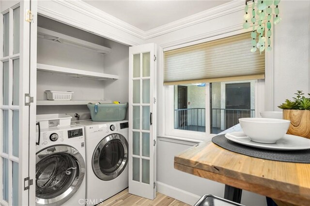 3600 E 4th St Unit 303, Long Beach, CA 90814 - laundry room featuring crown molding, light wood finished floors, washing machine and clothes dryer, and baseboards