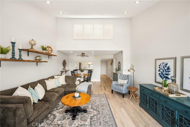 3600 E 4th St Unit 303, Long Beach, CA 90814 - living area featuring a towering ceiling, light wood-style floors, recessed lighting, and baseboards
