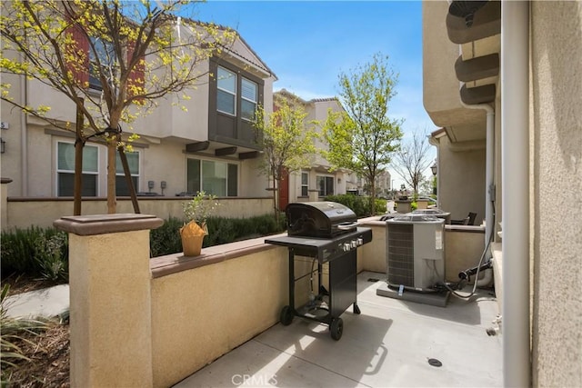 view of patio / terrace with central AC and area for grilling