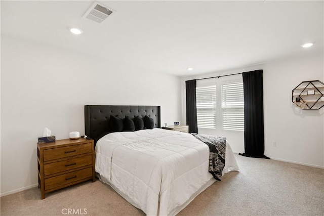 bedroom with light colored carpet, visible vents, baseboards, and recessed lighting