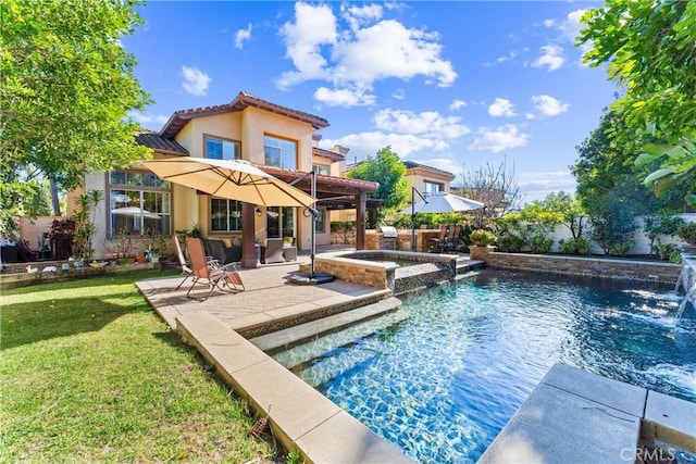 rear view of property with a patio, stucco siding, a pool with connected hot tub, a tiled roof, and a lawn